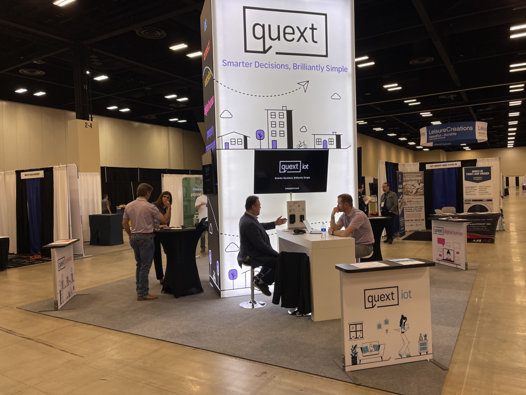 A photo on the Quext booth at a trade show.